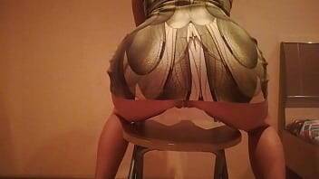 Erotic dance on a chair in a dress made of snake skin on vidfreenow.com