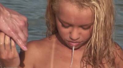 Blonde Beauty Gets Cum In Her Mouth In This Hot Threesome On The Beach on vidfreenow.com