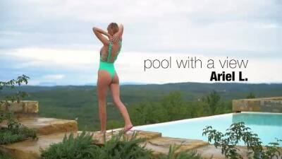 Lovely girl has a swimming pool with an amazing view, and likes posing nude next to it on vidfreenow.com