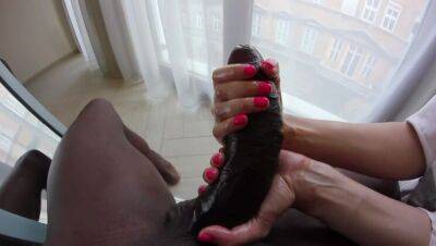 A petite blonde plays with the foreskin of a huge black cock. on vidfreenow.com