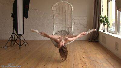 Flexible Beauty Ballerina Playfully Poses For Me In A Hanging Chair, Moving Her Long Legs Wide. 4 Of 6 on vidfreenow.com