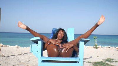 Ebony Latin Girl, Oil Skin And Public Orgasm On The Beach on vidfreenow.com