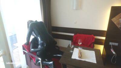 In Latex Covered Couple Enjoys A Good Drink on vidfreenow.com