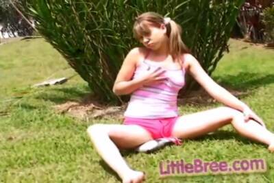 Petite Teen Strips Off Outdoors On The Grass on vidfreenow.com