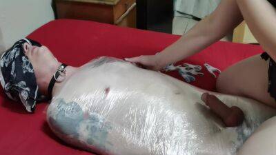 Mistress Wraps Her Slave In Clingwrap on vidfreenow.com