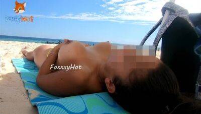 Flashing a little on the beach, showing my ass in a thong and my tits in the air on vidfreenow.com