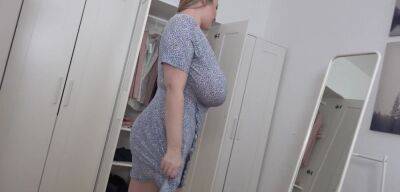 BBW blonde reveals her giant jugs while undressing on vidfreenow.com