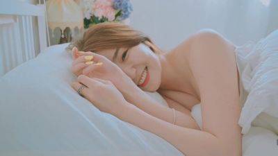 Good morning with young and beautiful Korean woman basking in bed - North Korea on vidfreenow.com