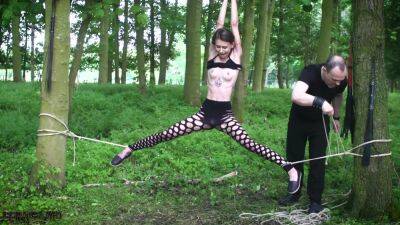 Submissive teen tied up in the woods on vidfreenow.com