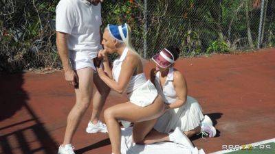 Sporty females take turns when sharing dick on the tennis court on vidfreenow.com