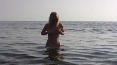 Divine Blonde Teen Blissfully Naked in the Sea on vidfreenow.com