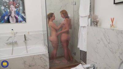 Mature star Effie Gold enjoys a steamy lesbian shower with Karry on vidfreenow.com