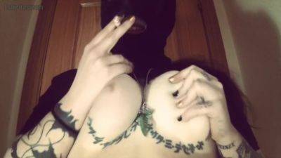 Girl With A Mask Plays With Her Tits And Smokes A Cigarette on vidfreenow.com