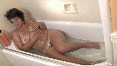 Big-titted brunette, Sayge, indulges in a steamy shower session and soaps up on vidfreenow.com