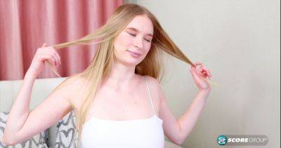 Asya, the blonde teen, spreads her legs wide open and toys her shaved cunt with a massive dildo on vidfreenow.com