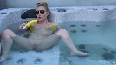 Sweet blonde inserts big dildo in her shaved pussy while in the pool on vidfreenow.com